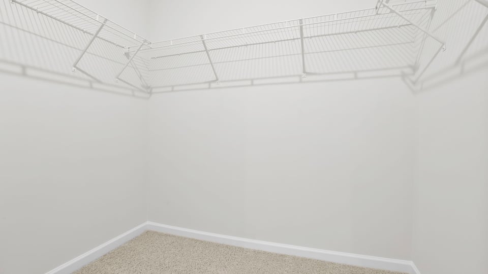 Primary closet with shelf.