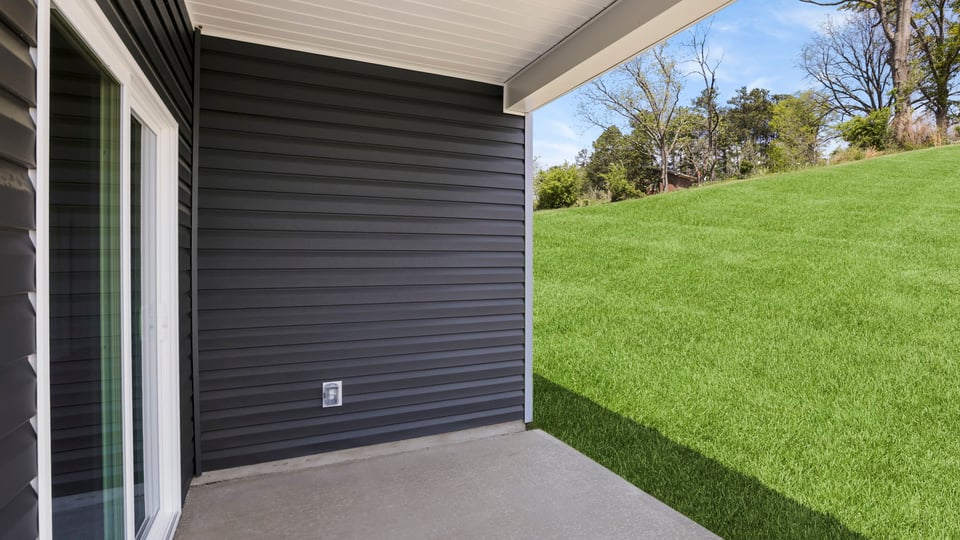 Back exterior with large backyard.