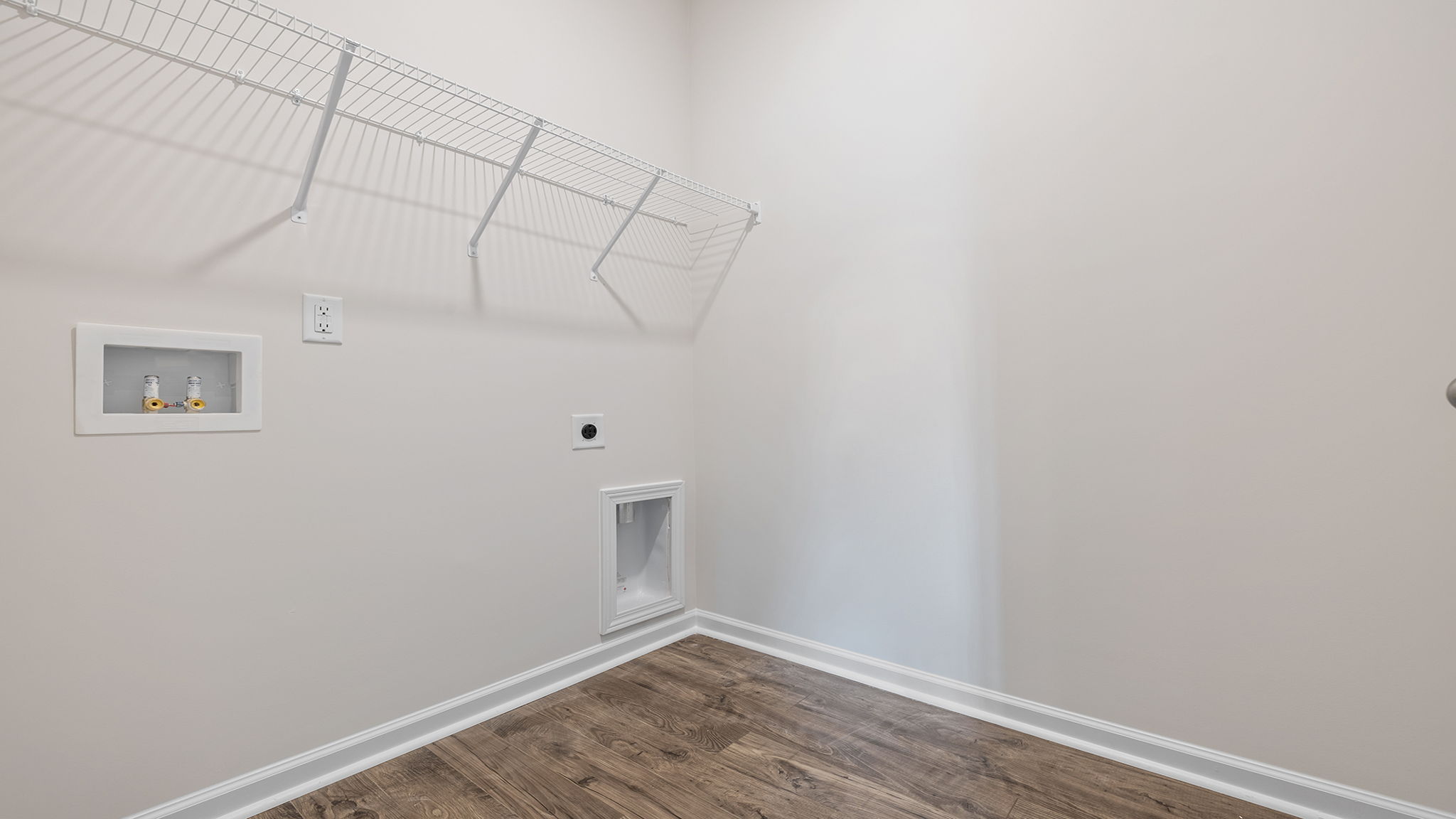Laundry room with shelf.
