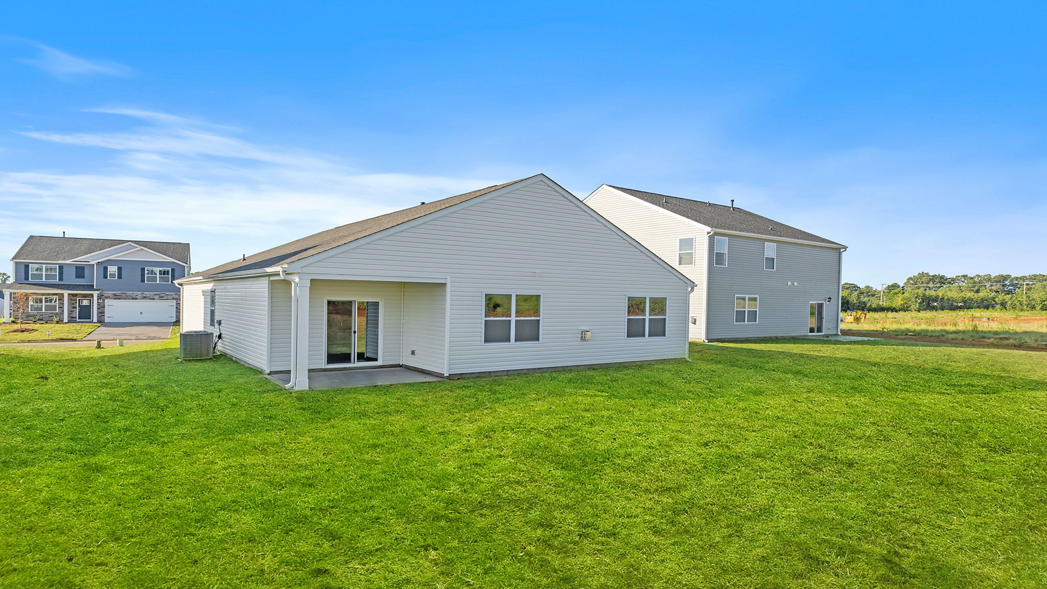 Back exterior with large backyard.