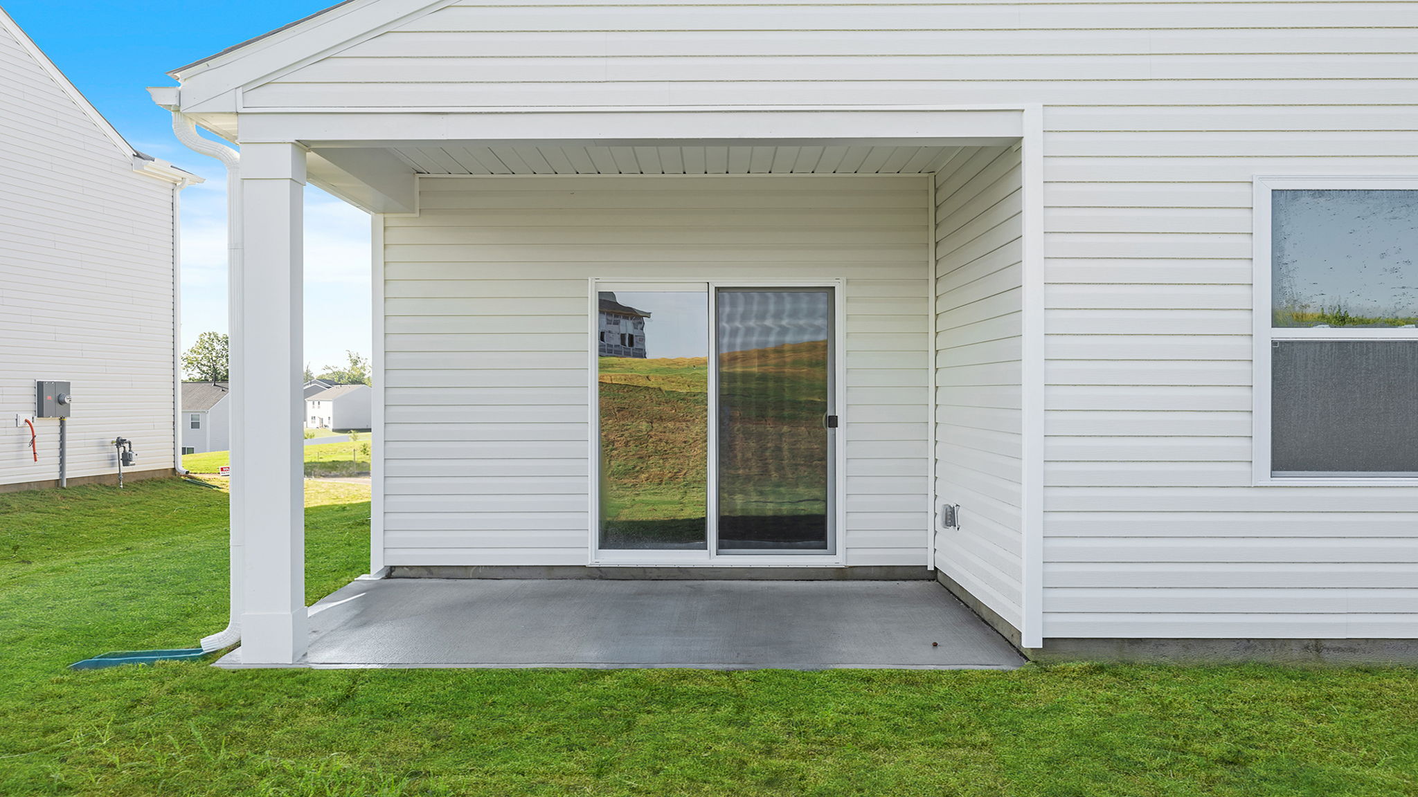 Back exterior with large backyard.