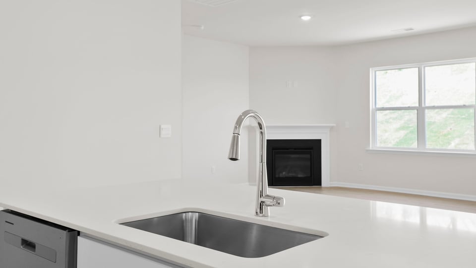 Kitchen with island and cabinets.