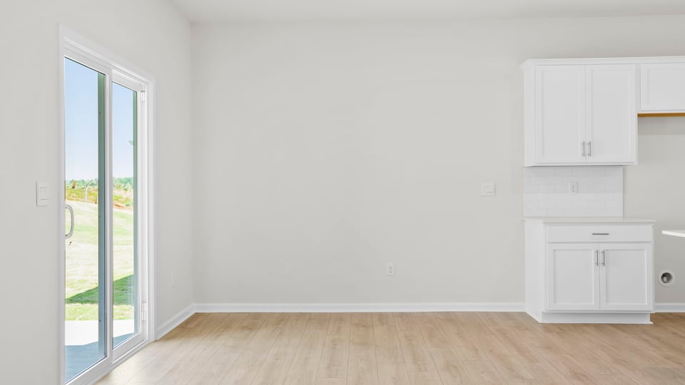 Living room with fireplace and windows.