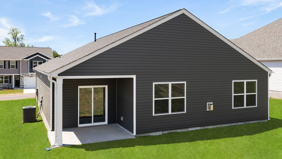 Back exterior with covered porch.