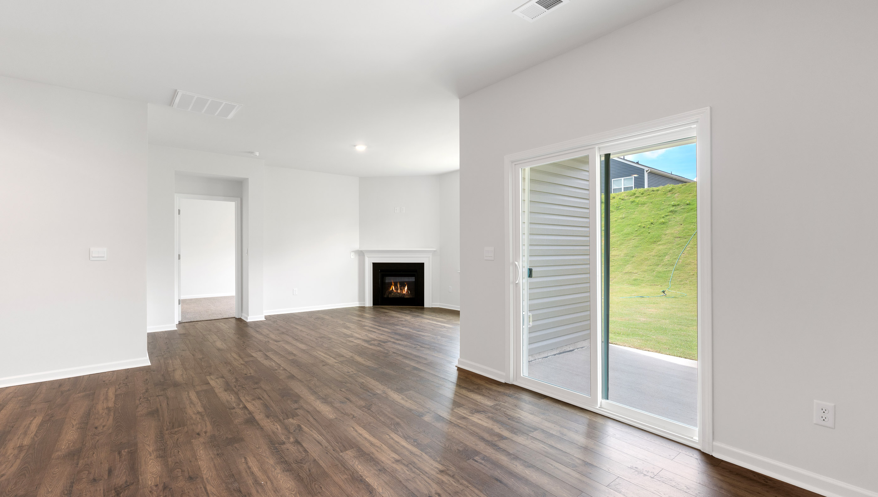 Living area with gas log fireplace.