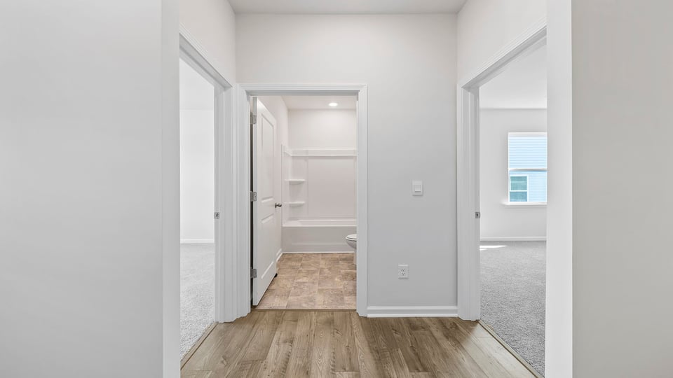 View of hallway noting the two bedrooms and hall bath.