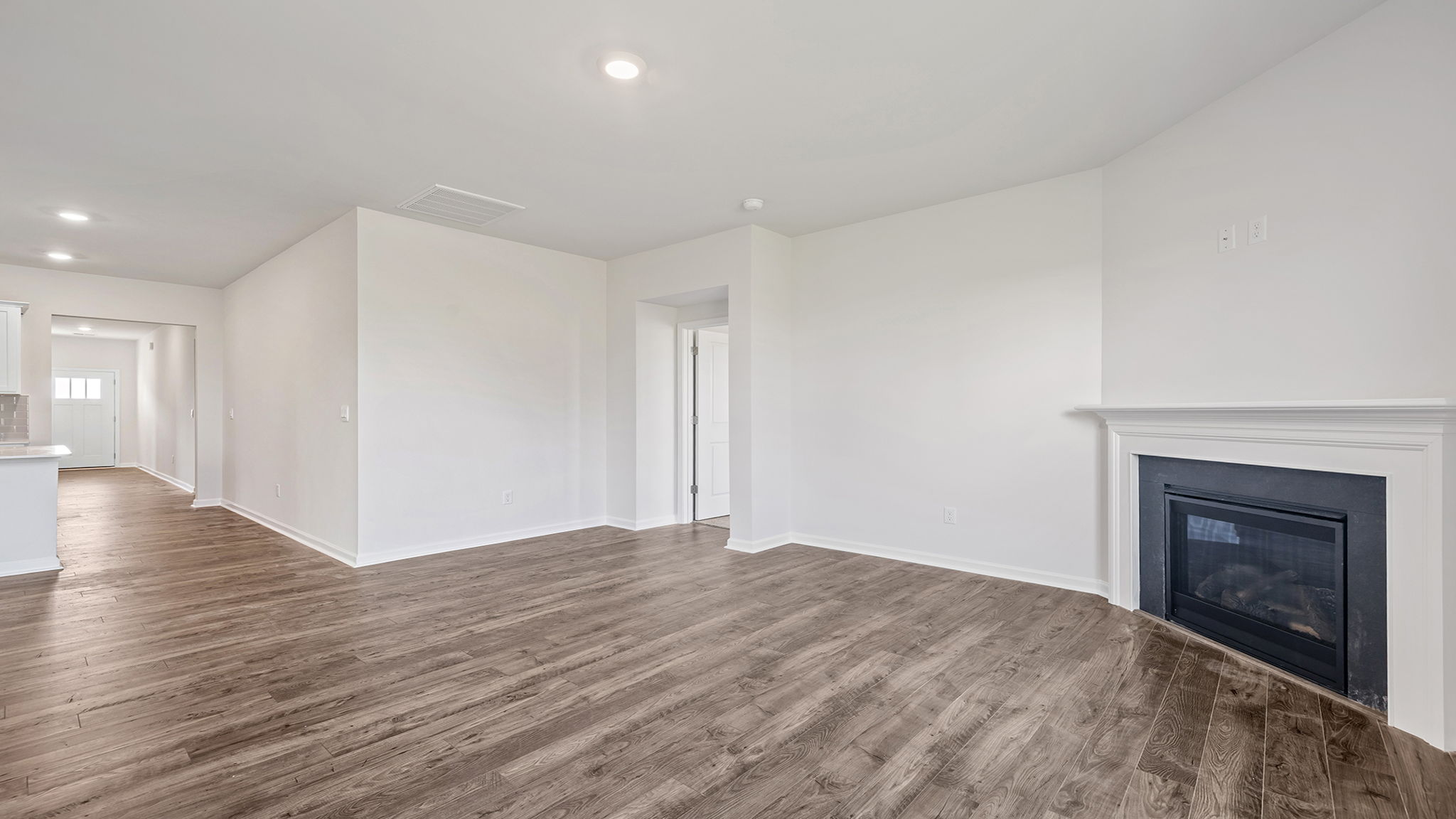 View of family room and hallway toward the entrance.