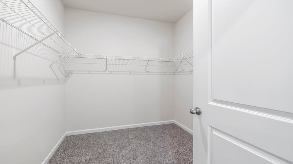 Primary walk-in closet.