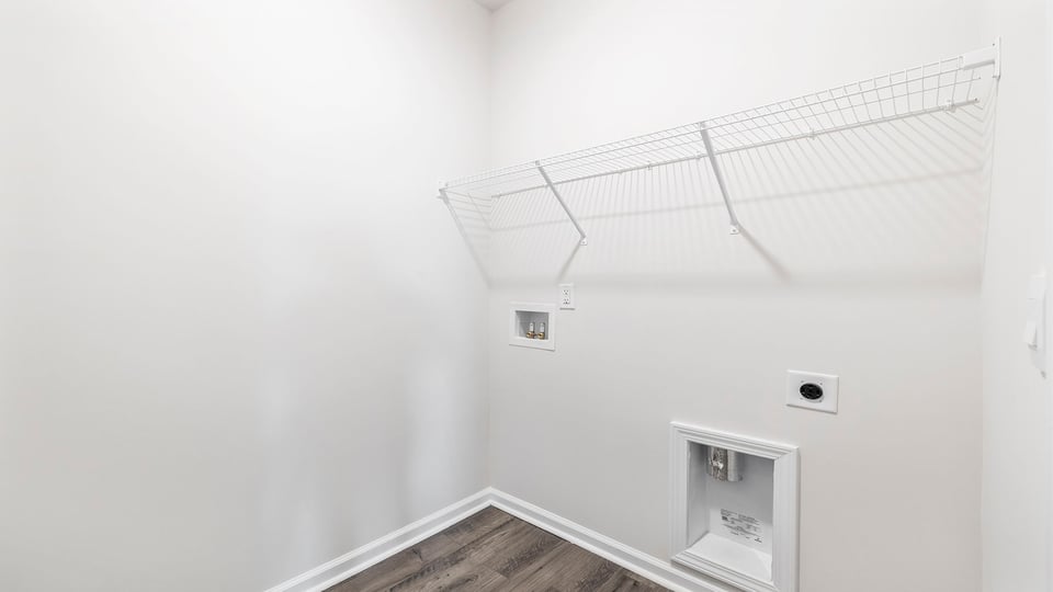 Laundry room with shelving.