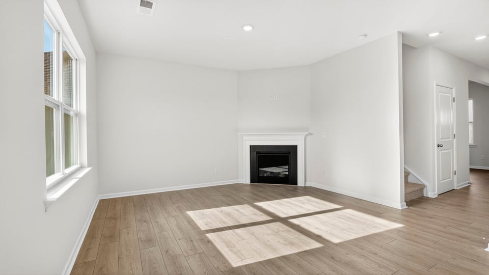 Living area with windows and fireplace.