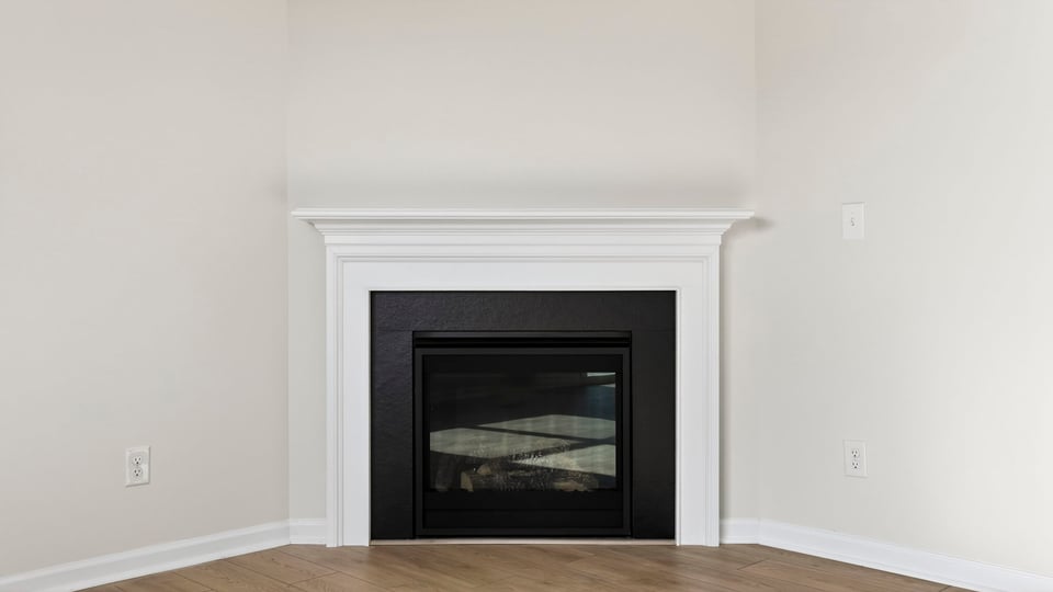 Living area with windows and fireplace.