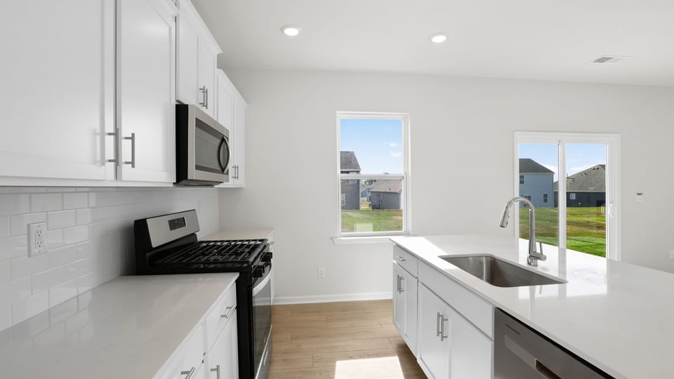 Kitchen with island and cabinets.