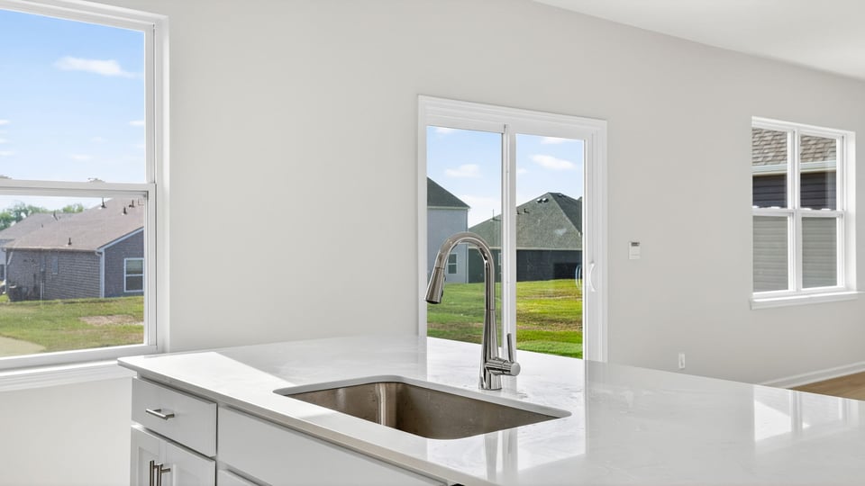 Kitchen with island and cabinets.