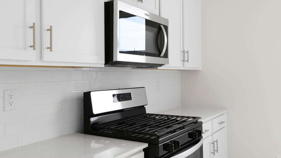 Kitchen with island and cabinets.