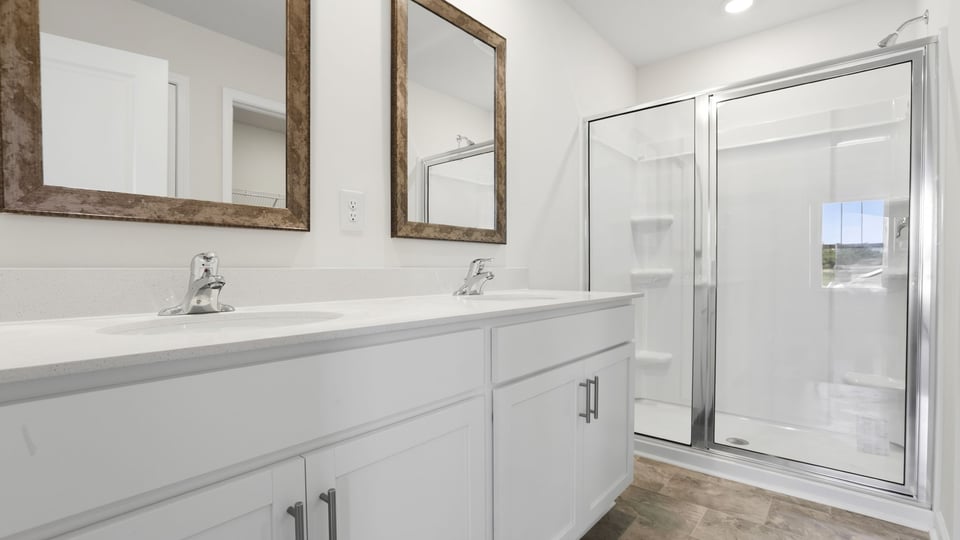 Primary bathroom with double vanity sinks.