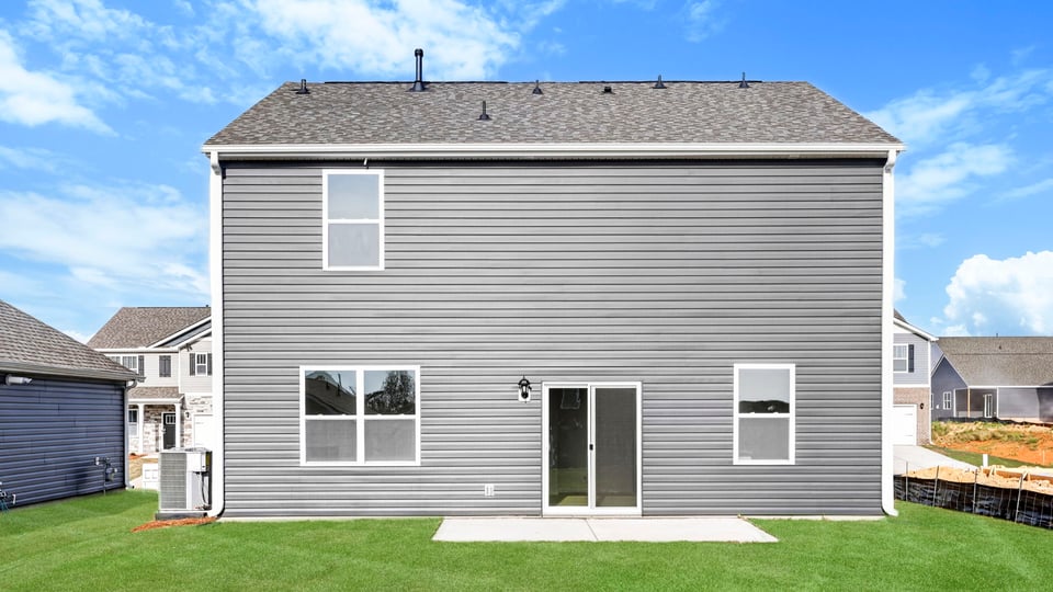 Back exterior with large backyard.
