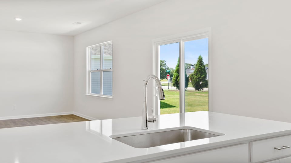 Kitchen with island and cabinets.