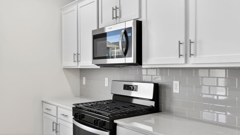 Kitchen with island and cabinets.