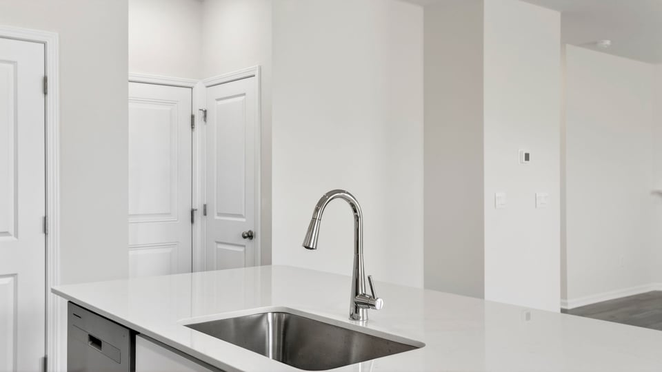 Kitchen with island and cabinets.