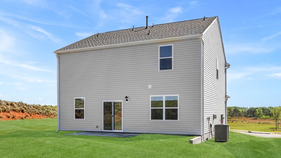 Back exterior with large backyard.