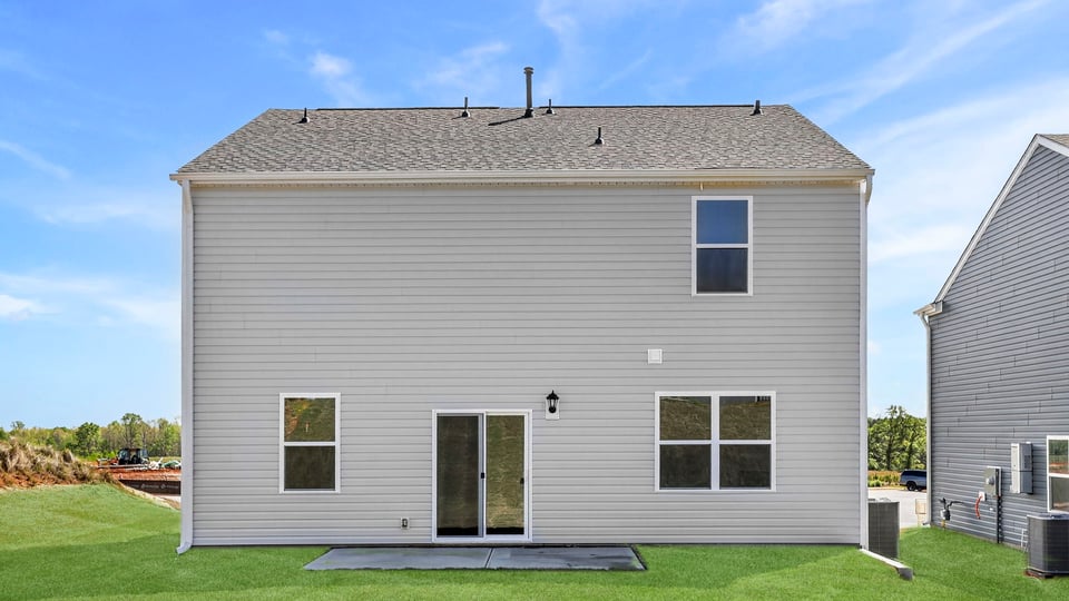 Back exterior with large backyard.