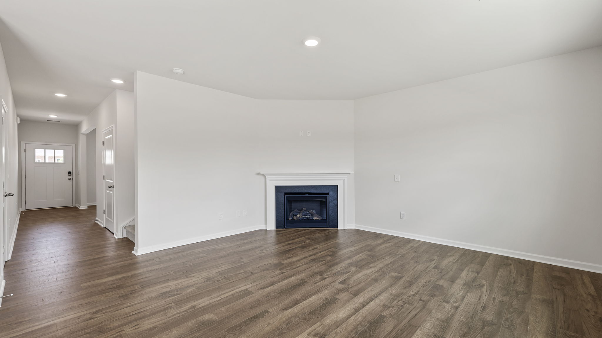 View of family room and hallway to the entrance.