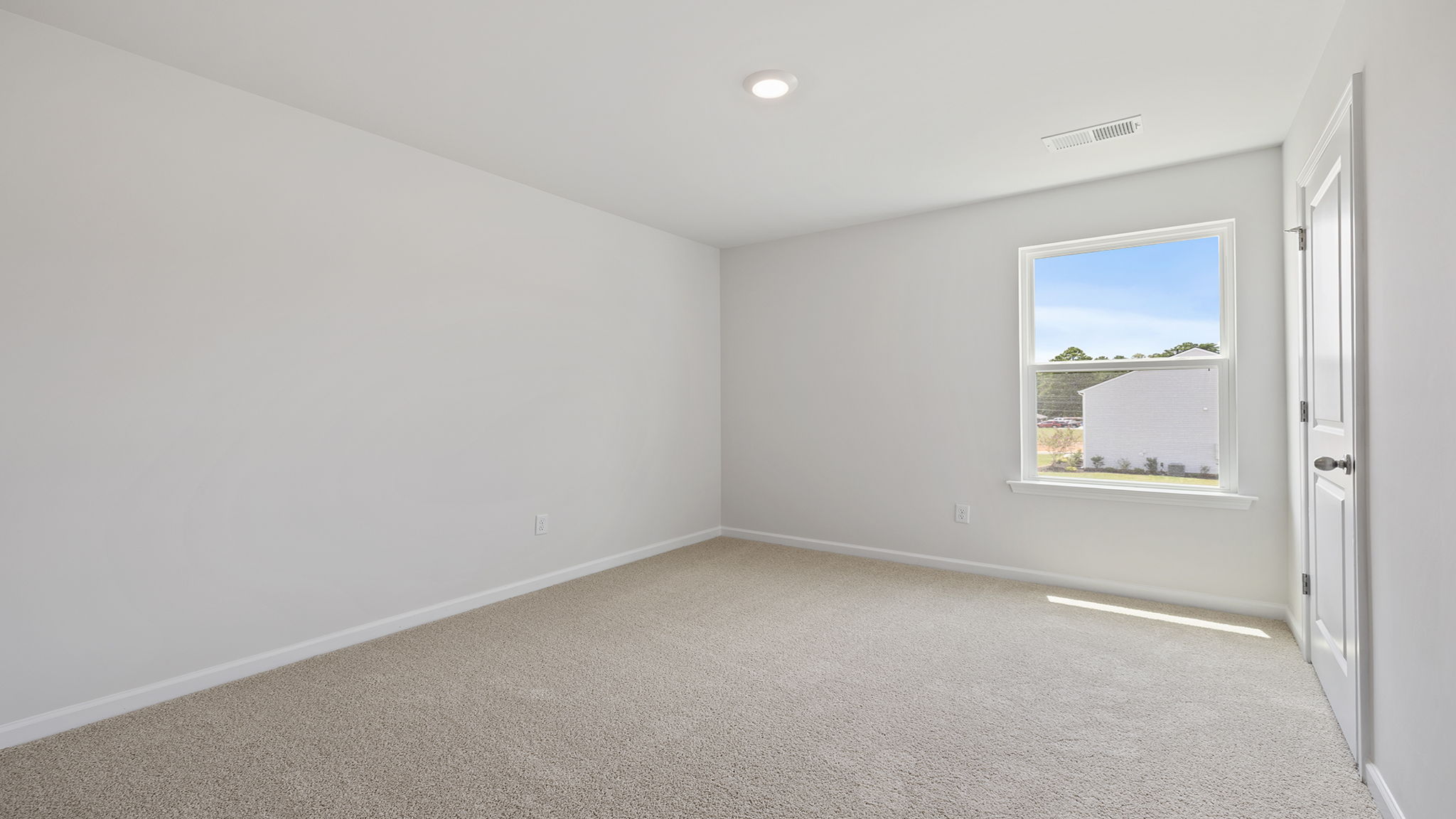 Bedroom with large window.