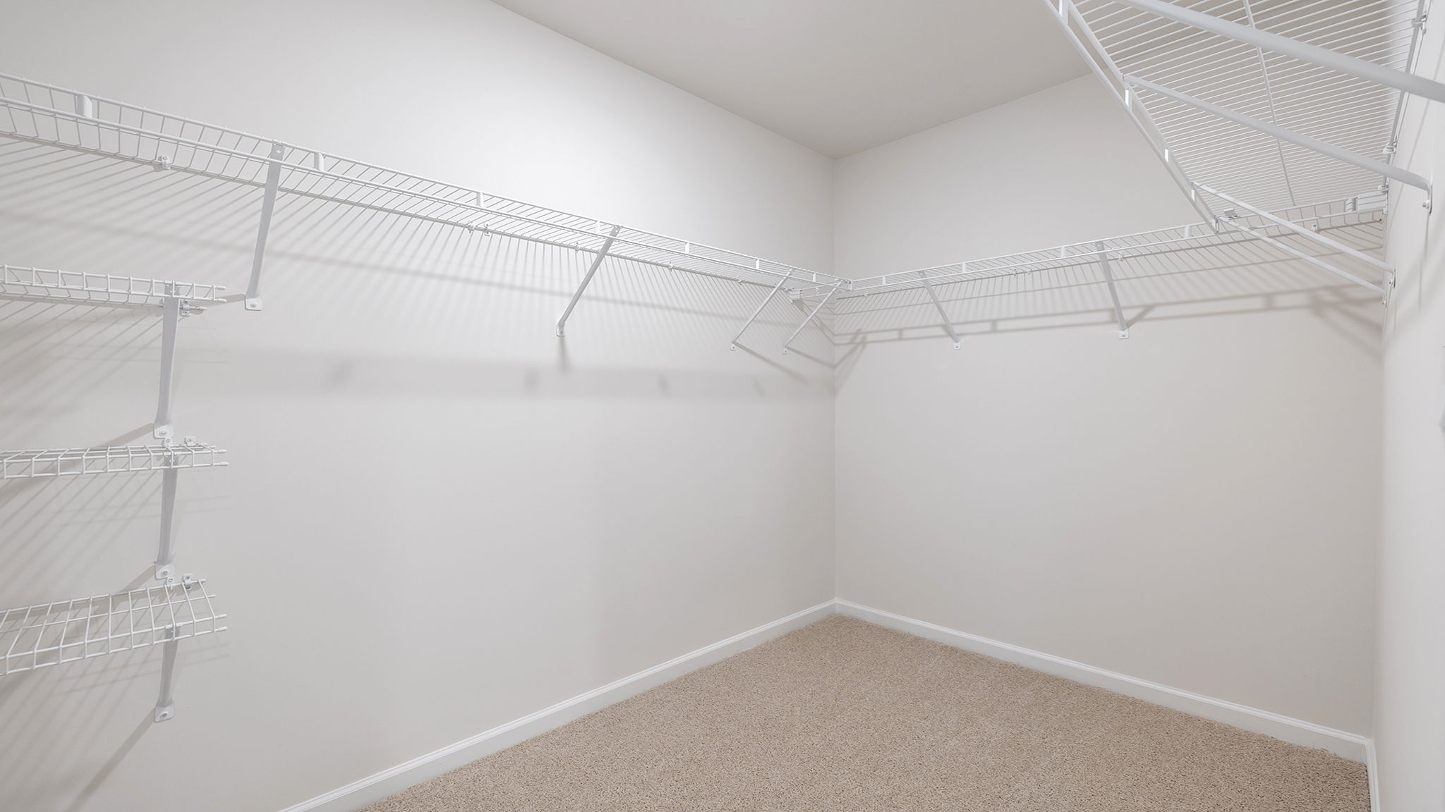 Primary bedroom walk-in closet.