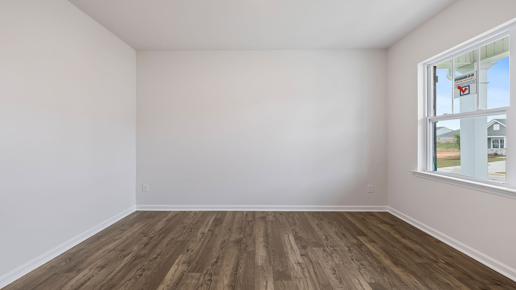 View of study with accenting large windows.