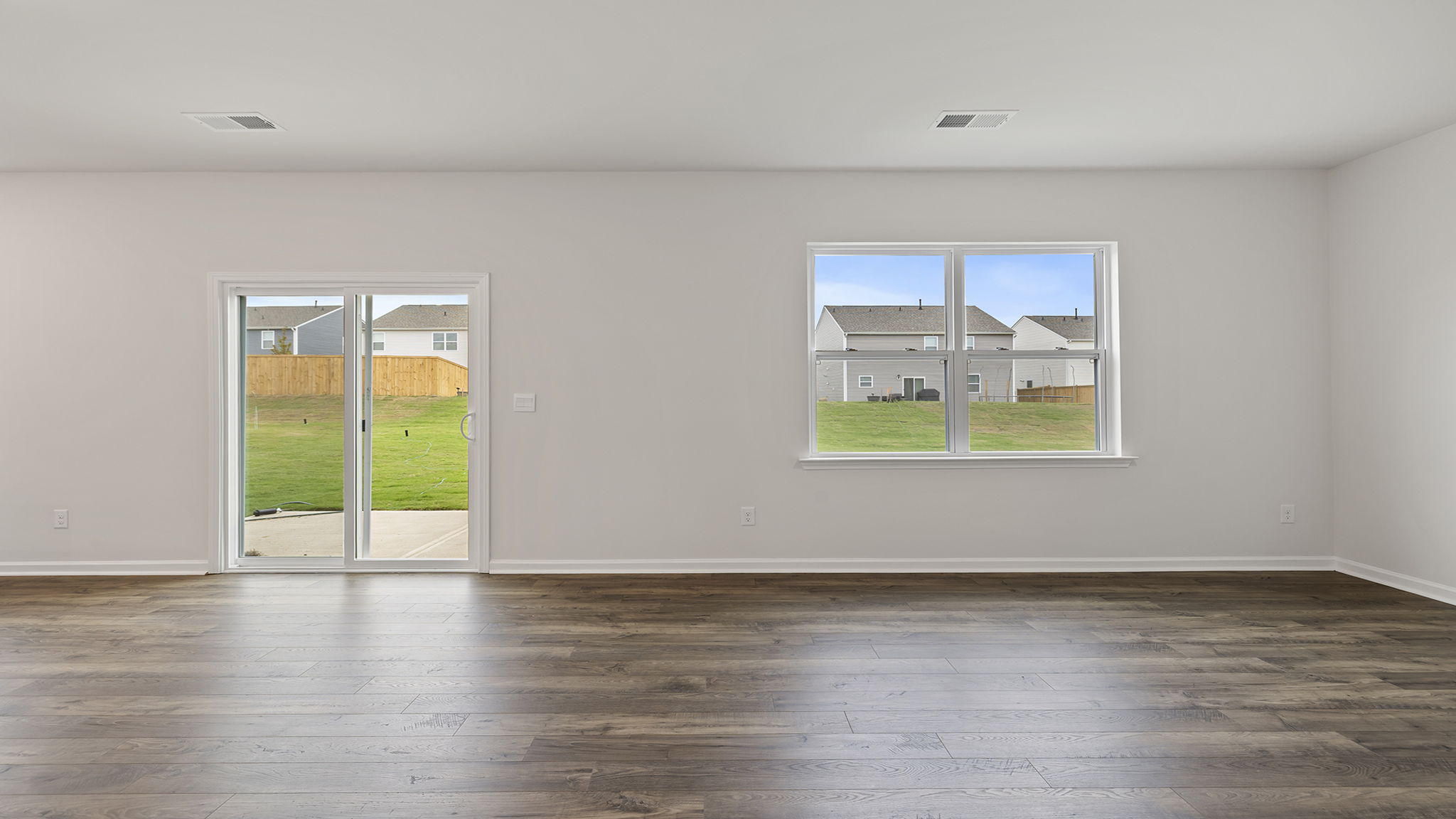 Family room with large window and door to the patio.