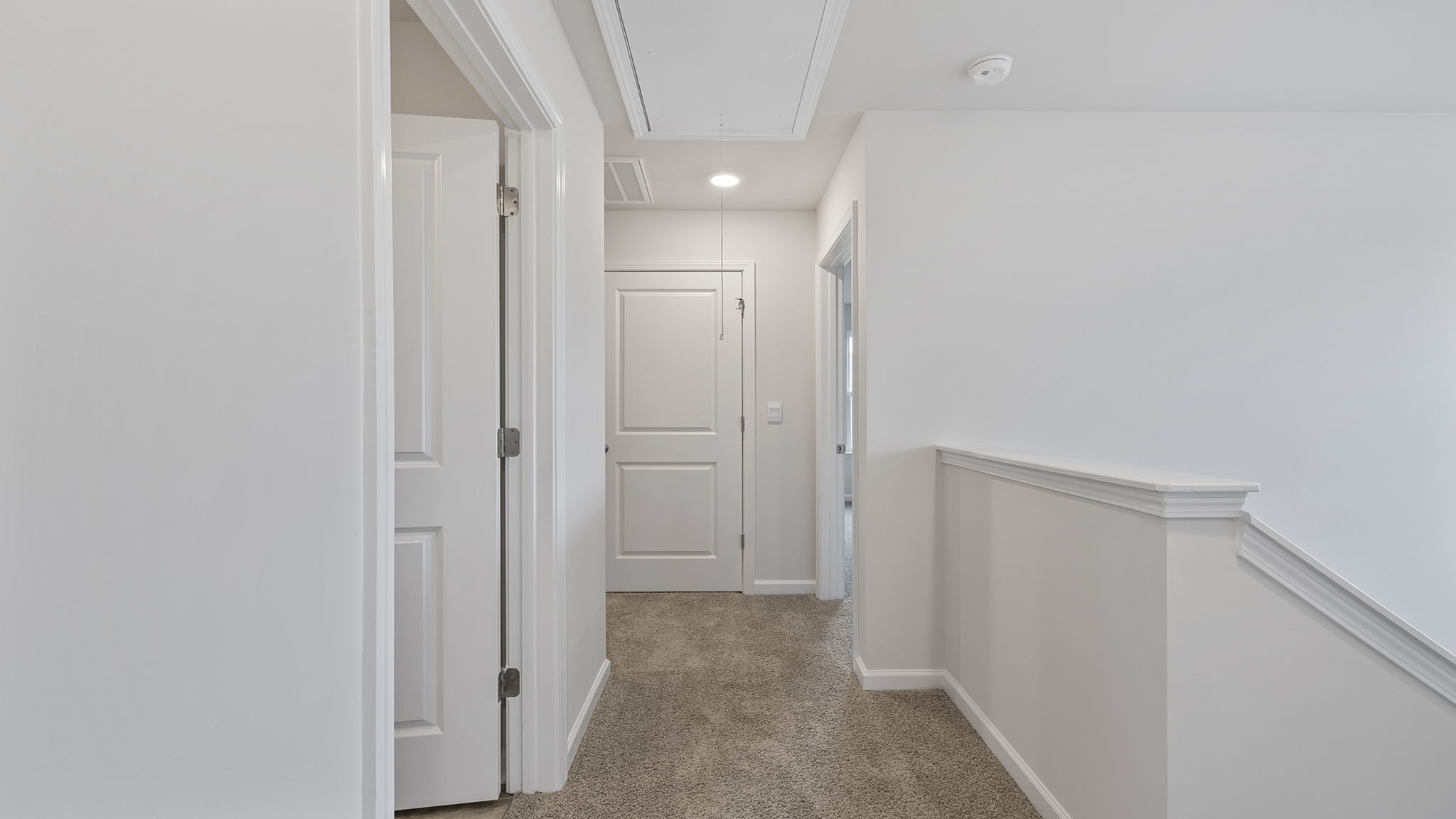 View of the upper level landing and hallway.