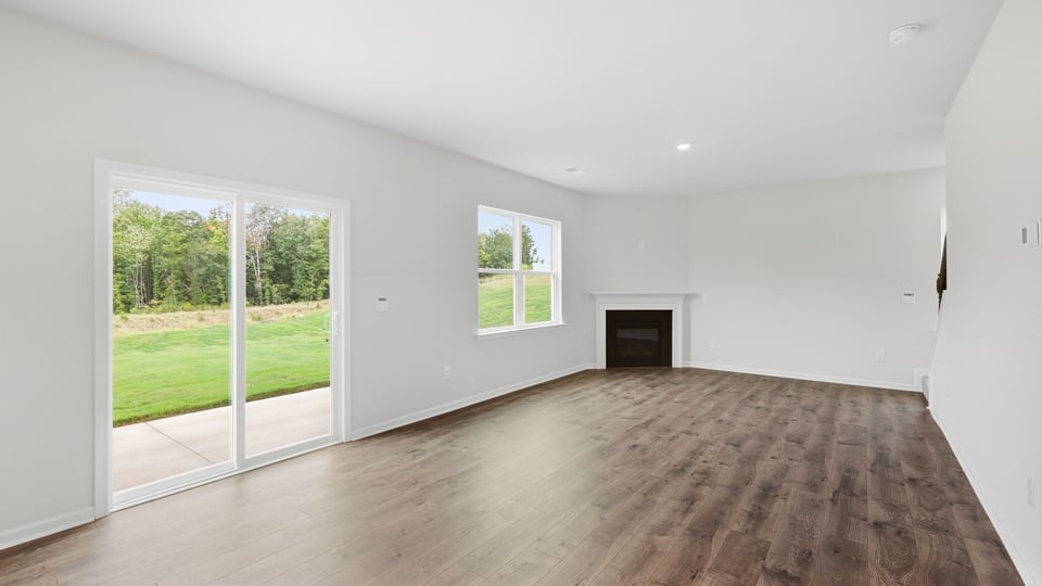 Living room with window and fireplace.