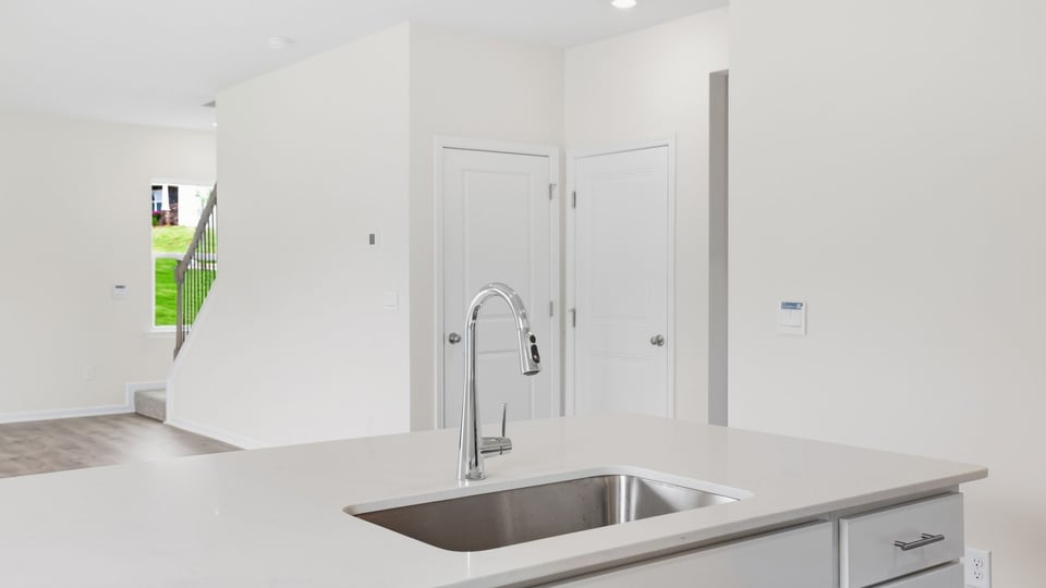 Kitchen with island and cabinets.