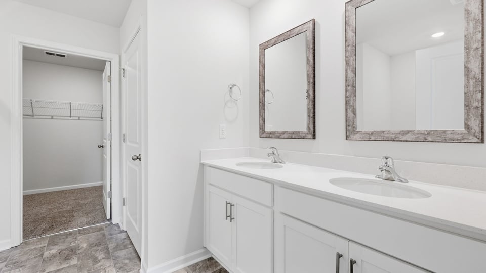 Primary bathroom with double vanity sinks.
