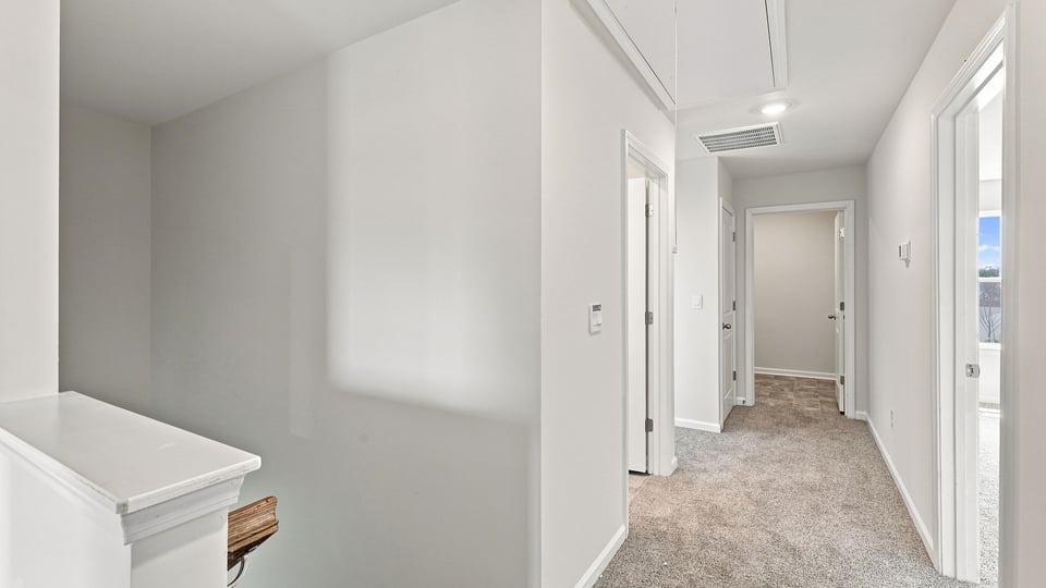 Bedroom with window and carpet.
