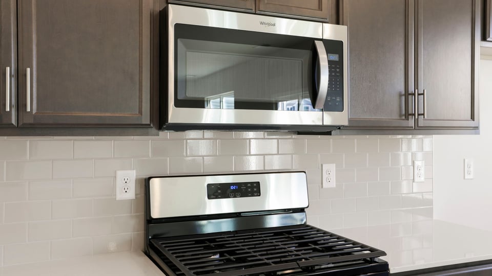 Kitchen with island and cabinets.