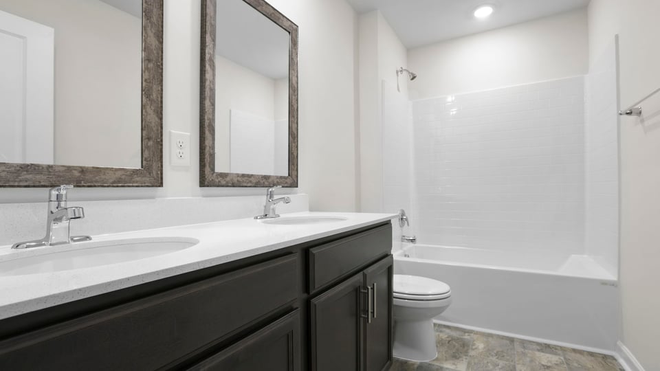 Bathroom with double vanity sinks.