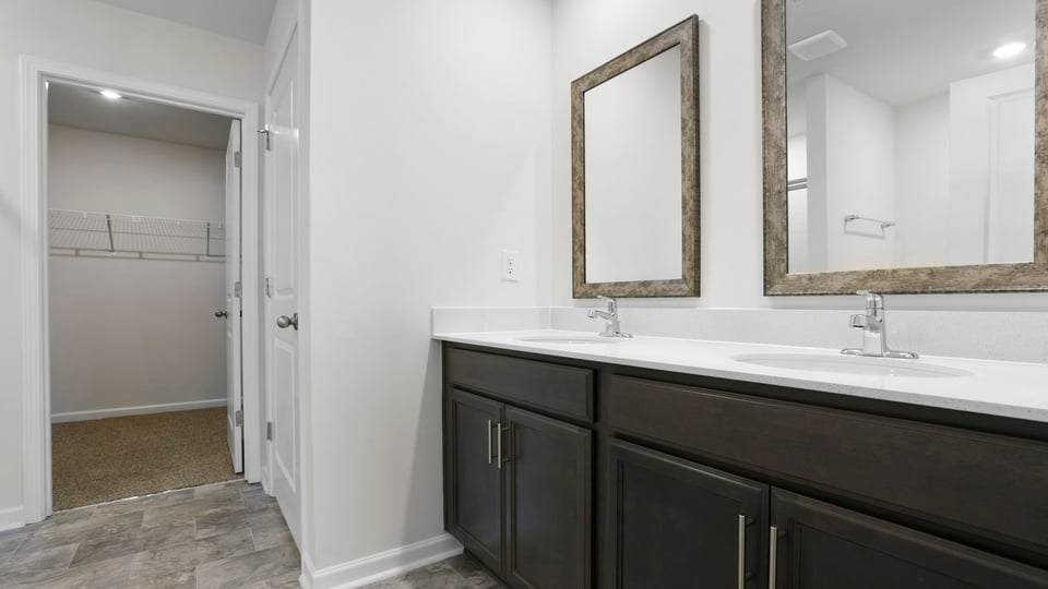 Primary bathroom with double vanity sinks.