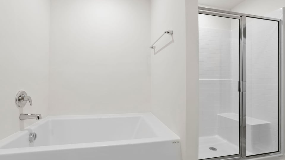 Primary bathroom with double vanity sinks.