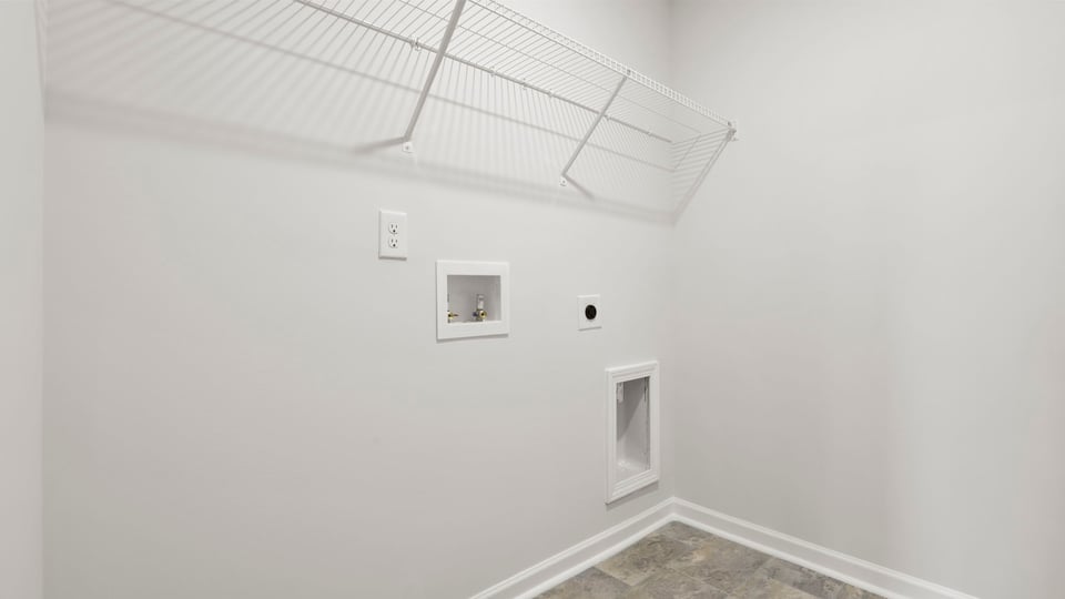 Laundry room with shelf.