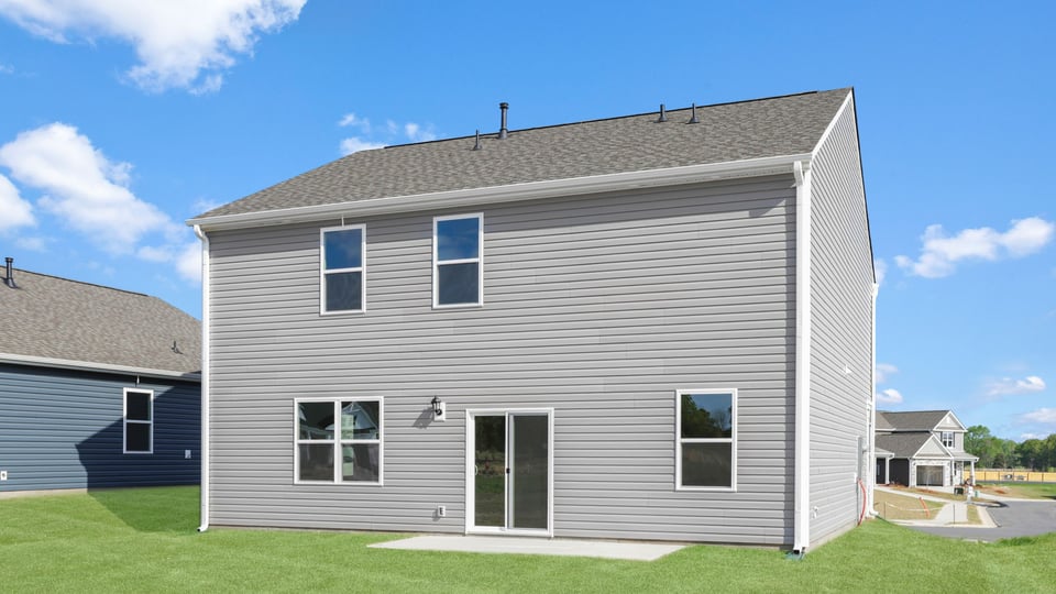 Back exterior with large backyard.