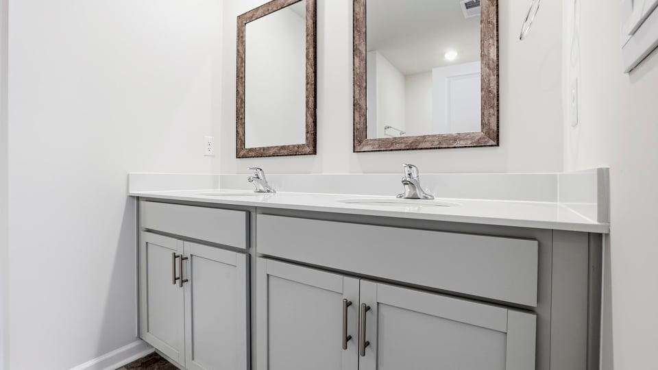 Primary bathroom with double vanity sinks.