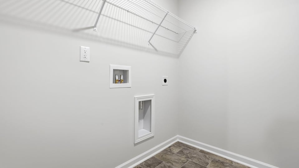 Laundry room with shelf.