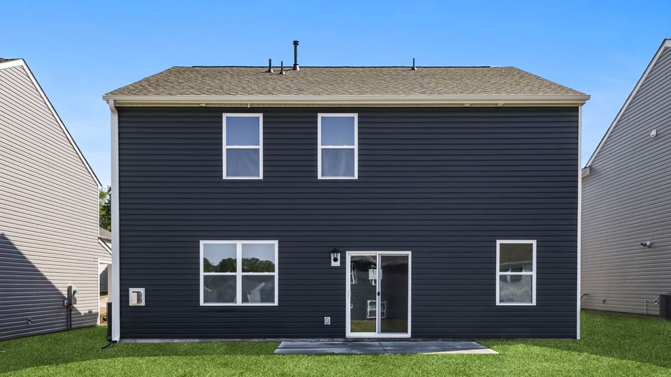 Back exterior with large backyard.