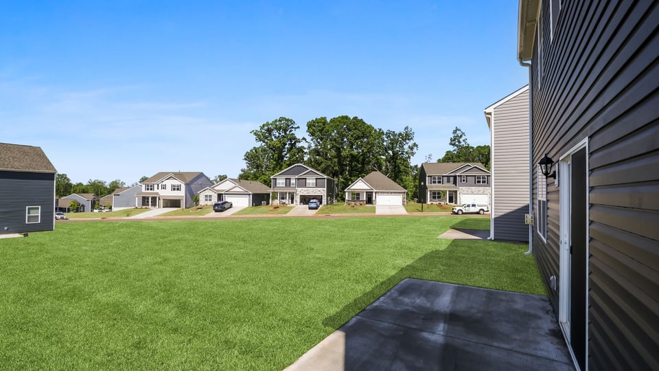 Back exterior with large backyard.