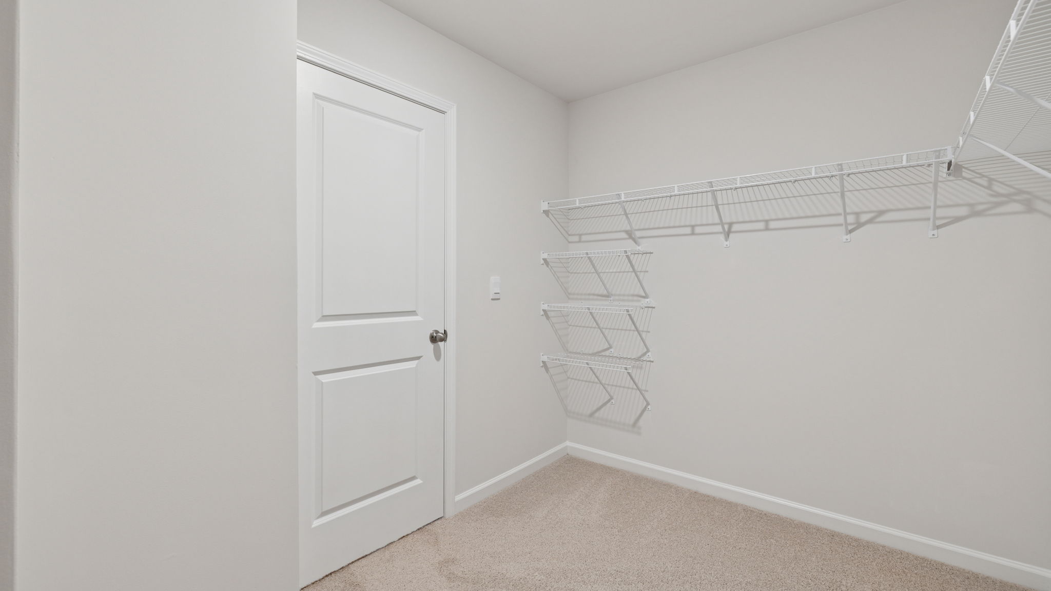 Primary bedroom walk-in closet.