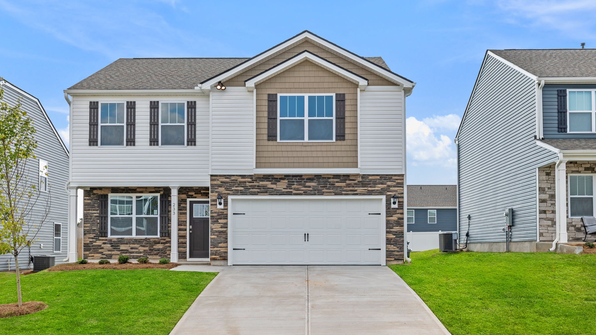 Front exterior of Penwell with 2 car garage.
