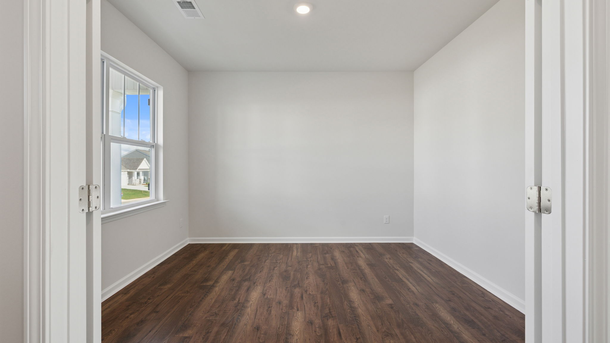 Study located at front of home with window.