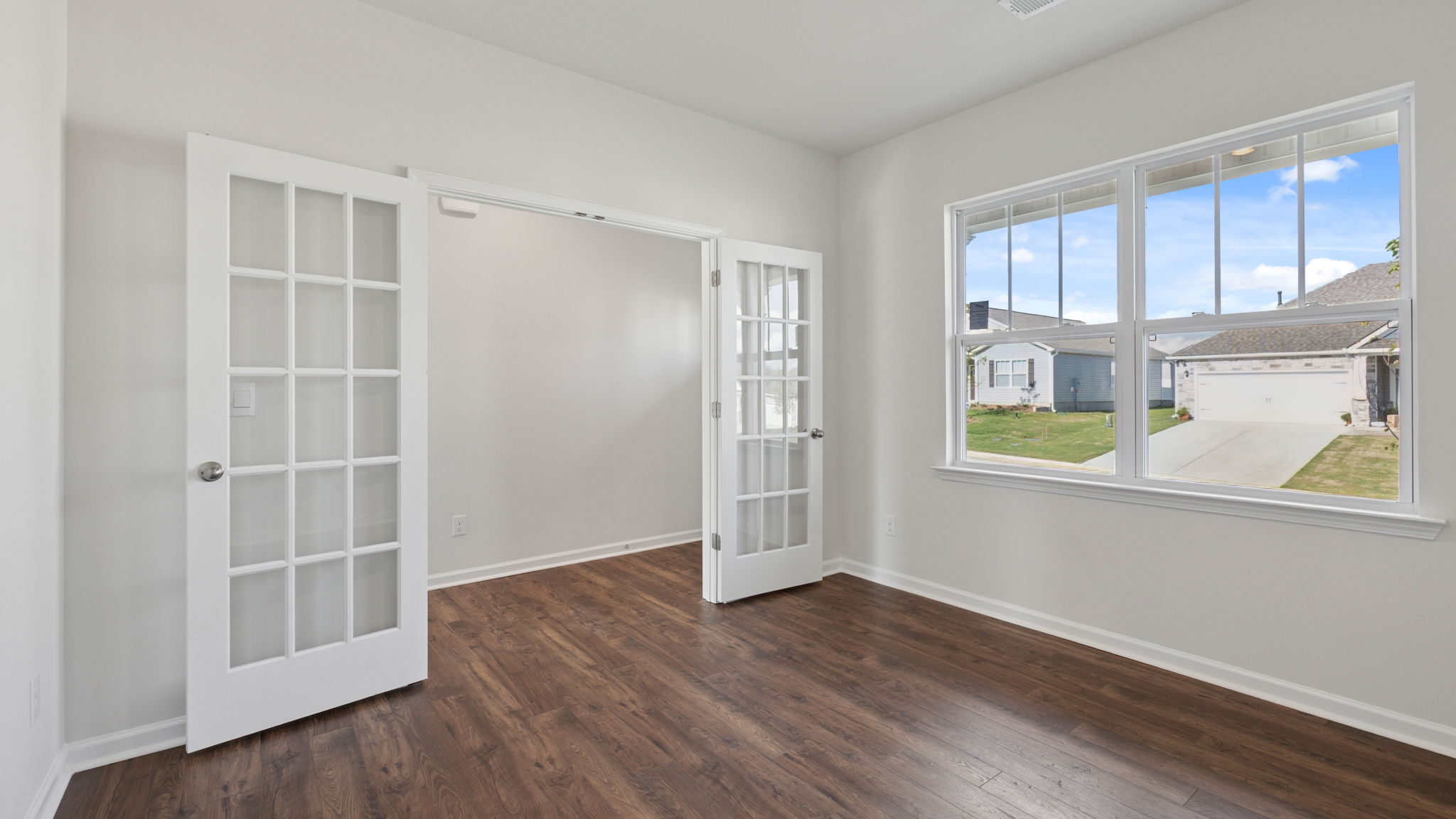 Study accented by French doors.
