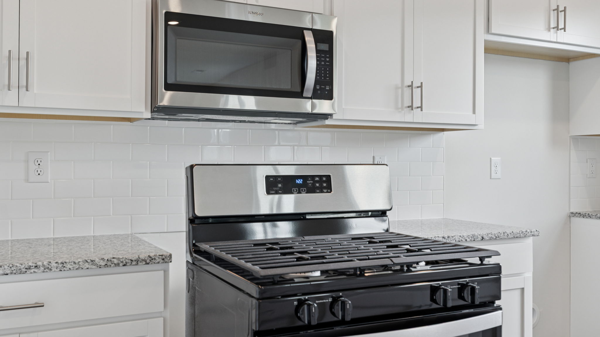 Kitchen with stainless steel appliances and walk in pantry.